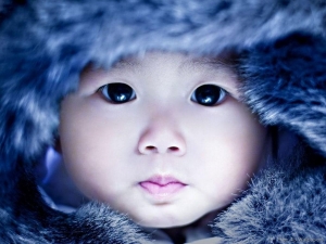Brave Eskimo Baby With Warm Winter Gear Cute Wallpaper